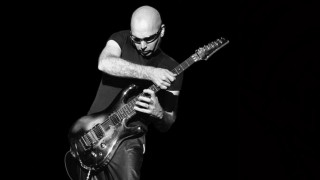Man playing guitar black background - a guitar free wallpaper