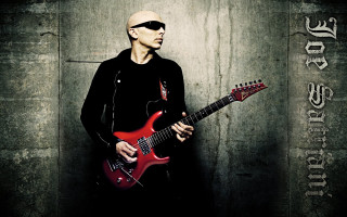 Man sunglasses red guitar wall - holding free wallpaper