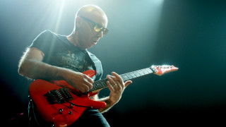 Man playing red guitar stage 2 - a red guitar free wallpaper