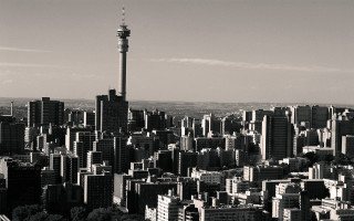 Black white city tower train - photo of a city free wallpaper