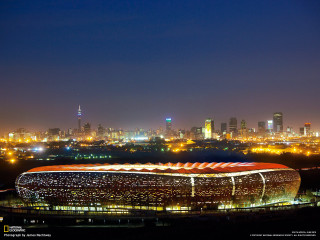 Large building lights night city - a city in the background free wallpaper