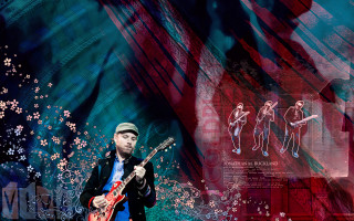 Man playing guitar colorful background - a guitar in front free wallpaper