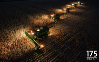 Green tractors night field lights - photograph free wallpaper