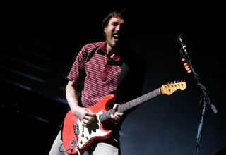 Man playing guitar stage microphone - stage free wallpaper