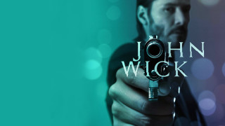 Man holding gun john wick - it in front free wallpaper