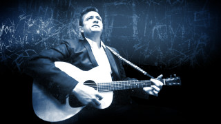 Man suit guitar dark room - a guitar free wallpaper