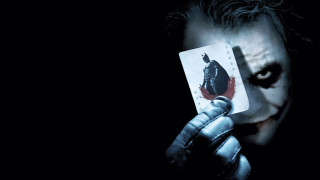 Man holding joker card knife 3 - a knife free wallpaper