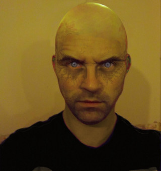 Bald man blue eyes serious - free cyberpunk wallpaper