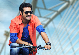 Man bike bridge sky blue - movie still frame free wallpaper