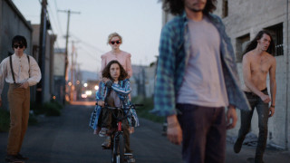 Biking group street building shirtless - a group of people riding free wallpaper