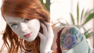Red hair tattoos woman arm - leaning against a wall free wallpaper