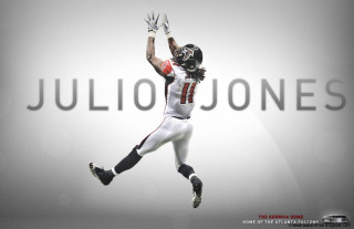 Football player jumping hands up - a football player free wallpaper