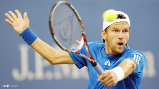 Man swinging tennis racket ball - a ball free wallpaper