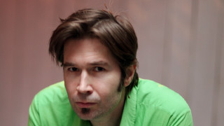 Man green shirt serious look - his face and shoulders free wallpaper