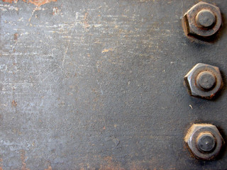 Metal plate four nuts rusted - hard surface free wallpaper