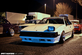 White car parking lot night 10 - a truck in the background free wallpaper