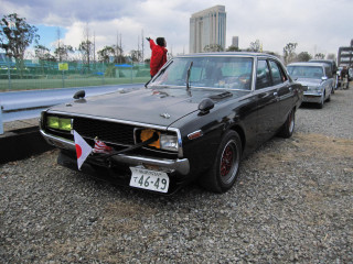 Black car flag hood parking - other car behind free wallpaper