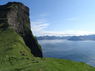 Grassy hill water mountains blue - a grassy hill free wallpaper