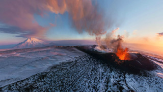 Volcano erupts lava sunset mountains - lava free wallpaper