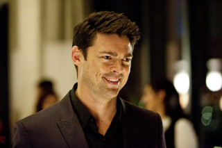 Man black shirt blazer smiling - a blurry background free wallpaper for desktop