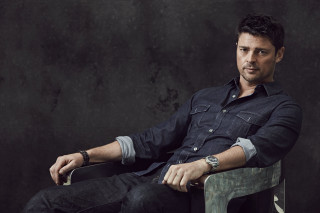Man sitting chair arms crossed 5 - derek hill free wallpaper