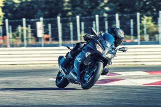Person riding motorcycle race track - a person riding free wallpaper