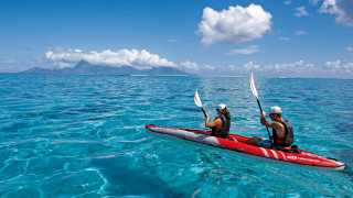 Red kayak ocean mountains blue - blue water free wallpaper