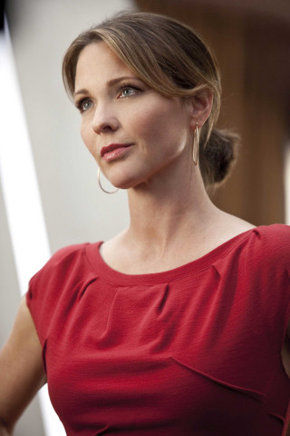 Woman red dress serious look - her face and shoulder free wallpaper