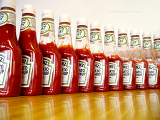 Ketchup bottles row table shelf - a tilt shift photo free wallpaper