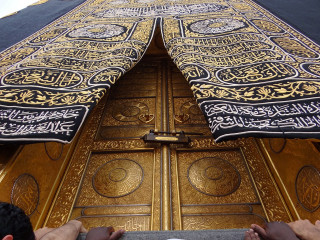 Person standing golden door cross - golden free wallpaper