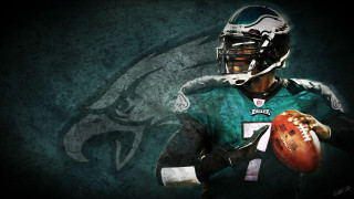 Football player holding ball green 2 - a football player holding free wallpaper