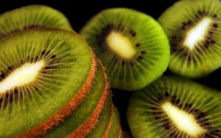 Kiwi fruit sliced closeup stacked - dom qwek free wallpaper