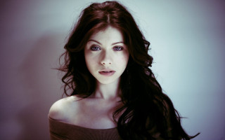 Gothic portrait pale skin black - a white wall behind her free wallpaper