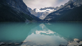 Mountain range reflection lake rocks 9 - a mountain range in the background free wallpaper
