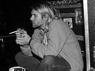 Man sitting floor smoking cigarette - brad holland free wallpaper