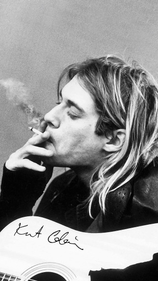 Man smoking cigarette holding guitar 2 - a guitar free wallpaper
