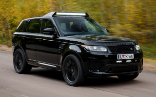 Black range rover driving road - yellow leaf free wallpaper