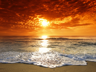 Sunset ocean waves orange sky - a sunset over the ocean free wallpaper