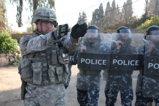 Soldier pointing gun police officers - institutional free wallpaper