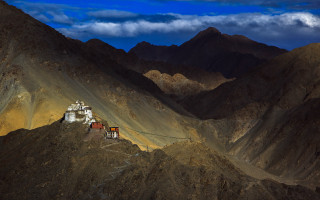 Mountain small building cloudy sky - a cloudy sky free wallpaper