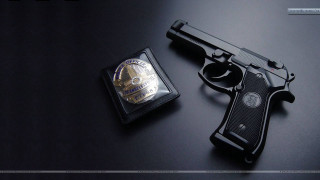 Gun badge black surface silver - a black surface free wallpaper