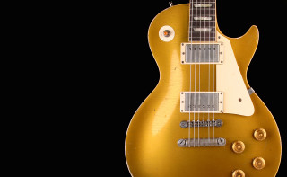 Gold electric guitar black background - eric peterson free wallpaper