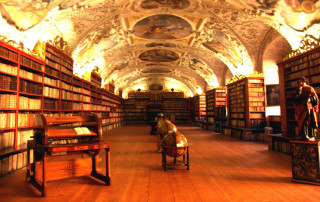 Large library man sitting middle - book free wallpaper