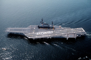 Aircraft carrier ocean boat background - a smaller boat in the background free wallpaper