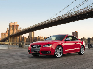 Red car parked bridge city - a bridge in front free wallpaper