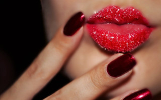 Woman hand red manicure lip - glossy free wallpaper