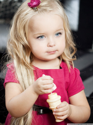 Little girl holding stick food - portrait photography free wallpaper