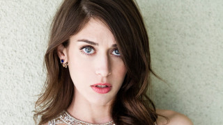 Woman blue eyes necklace white - a white wall behind her free wallpaper