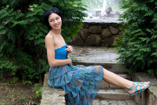Blue dress woman sitting waterfall - fashion photoshoot free wallpaper