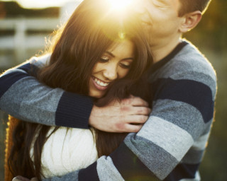 Man woman hugging field grass 3 - free love wallpaper